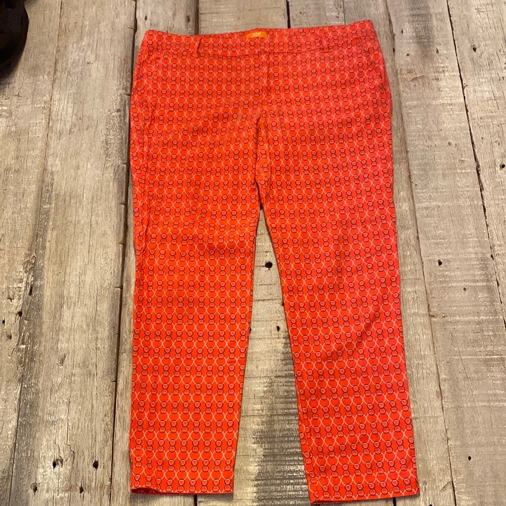 Orange pants with circle pattern.